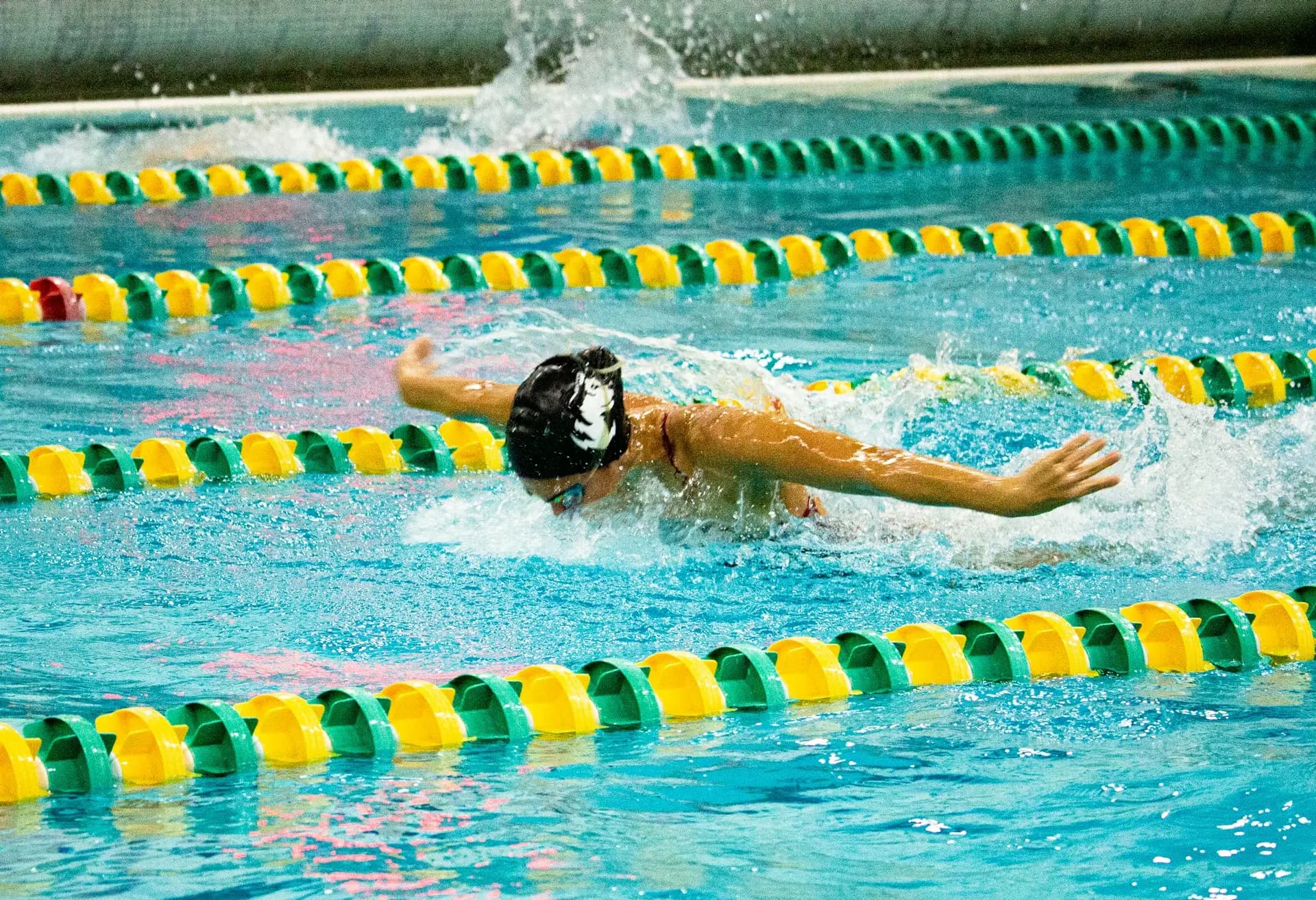 Swimmers racing in a competition pool