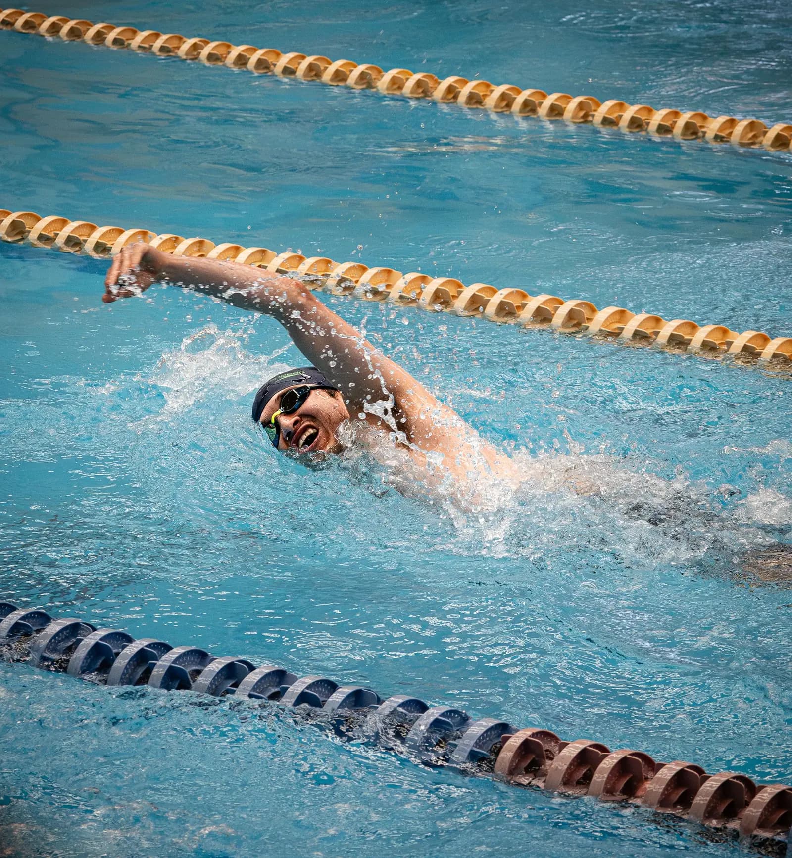 Swimmer doing freestyle in a competition pool