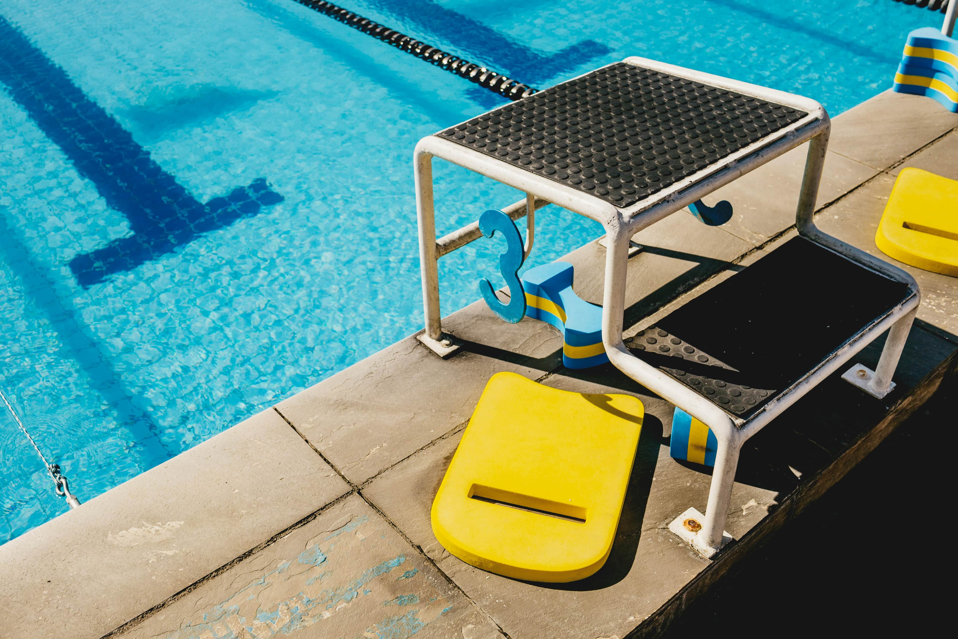 Swimmer diving into a pool